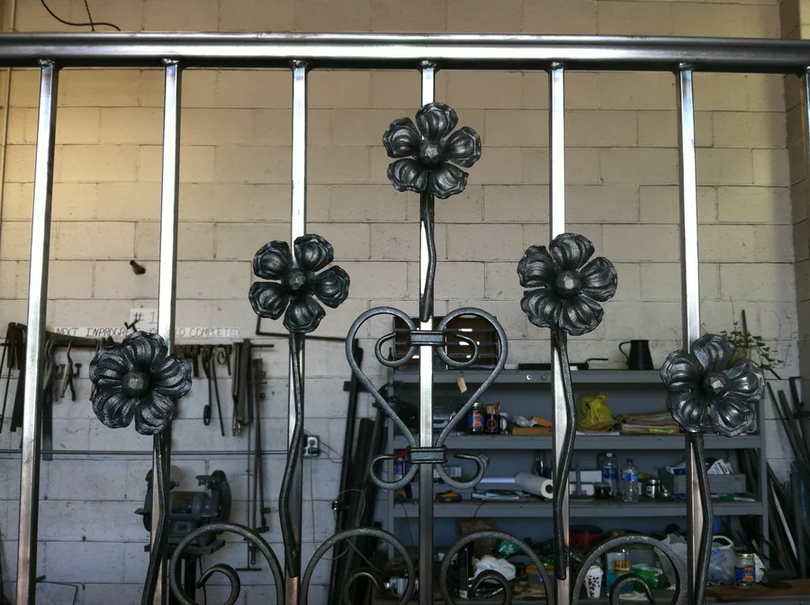 Decorative iron scrollwork being formed in the fabrication shop