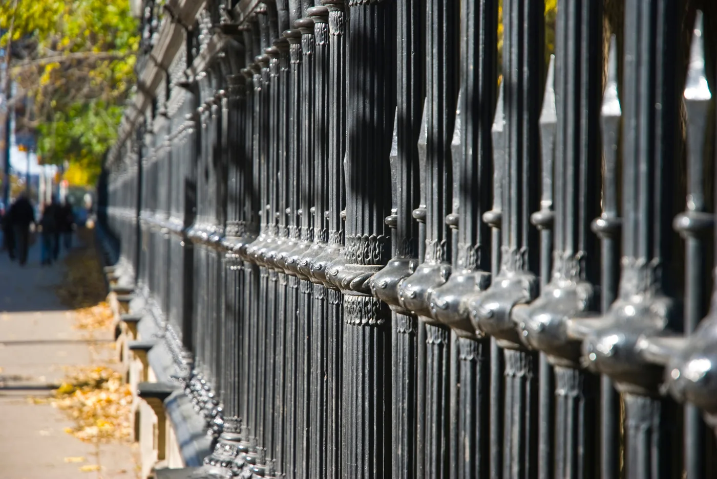 pf-iron-rows.webp Rows of black ornamental iron fence panels