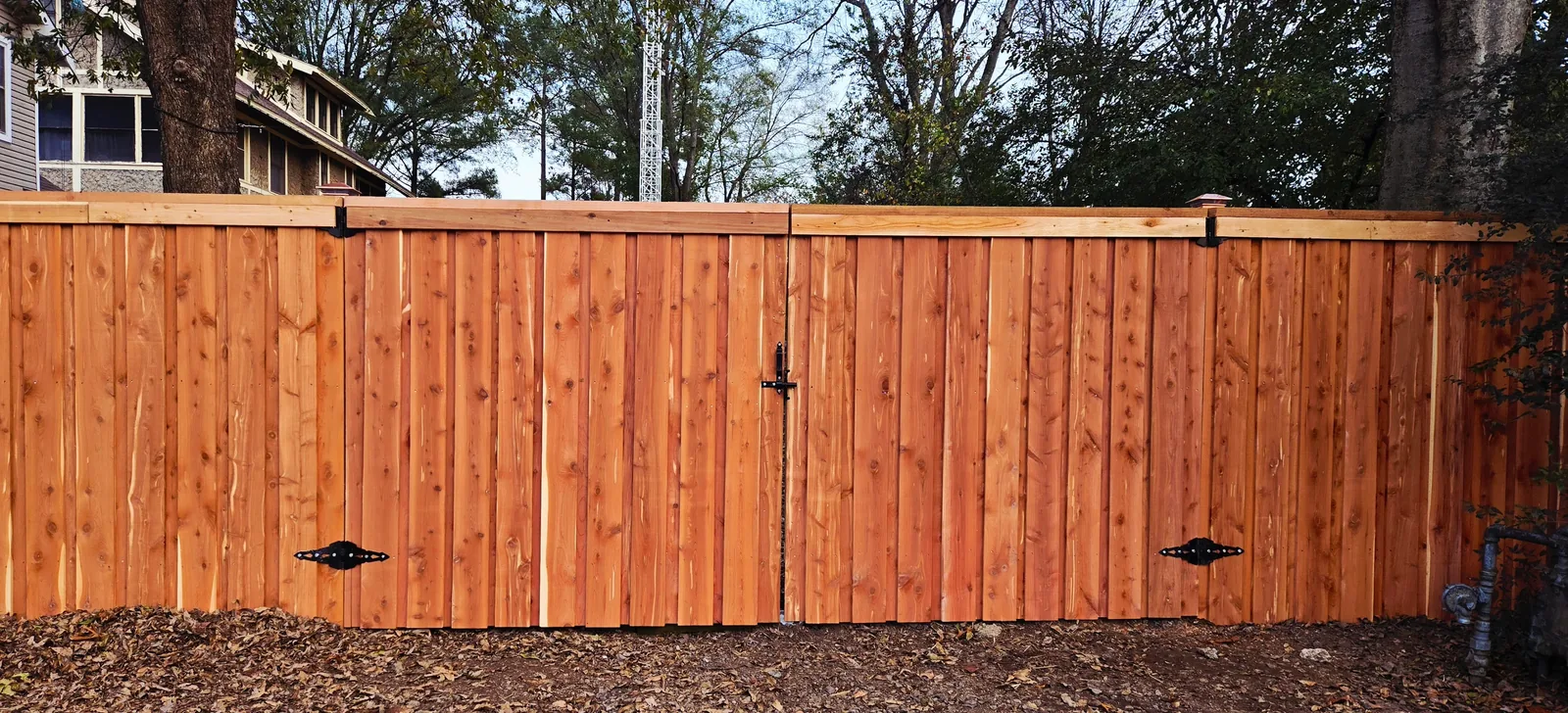 pf-cedar-gate.webp Matching cedar double gate set into a privacy fence