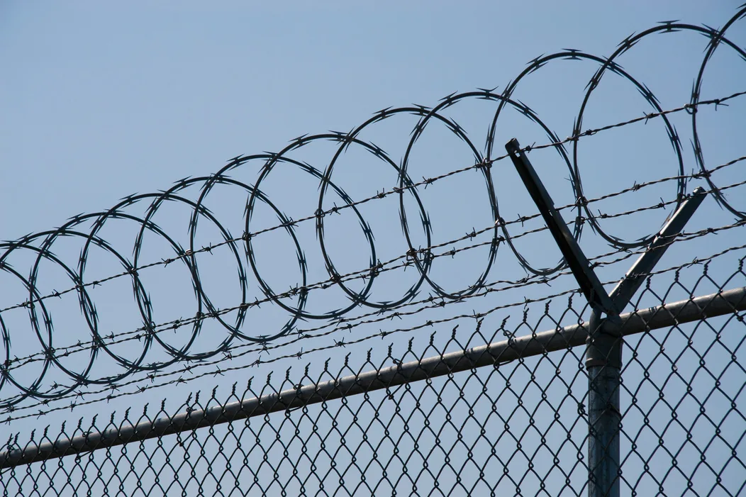 Razor wire topping installed above a chain link perimeter
