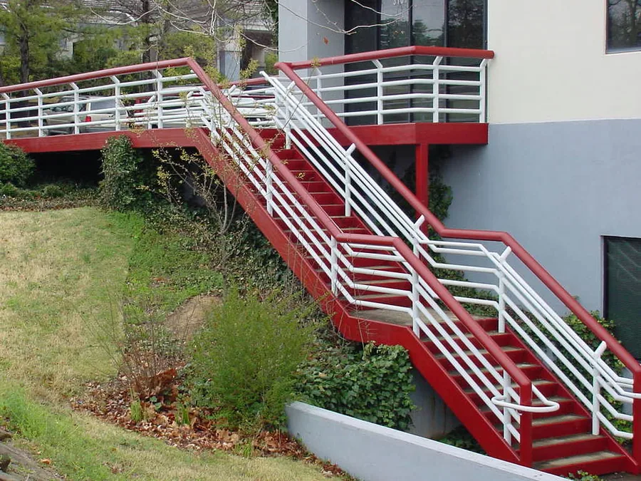 Fabricated exterior steel stair and landing system on a commercial building
