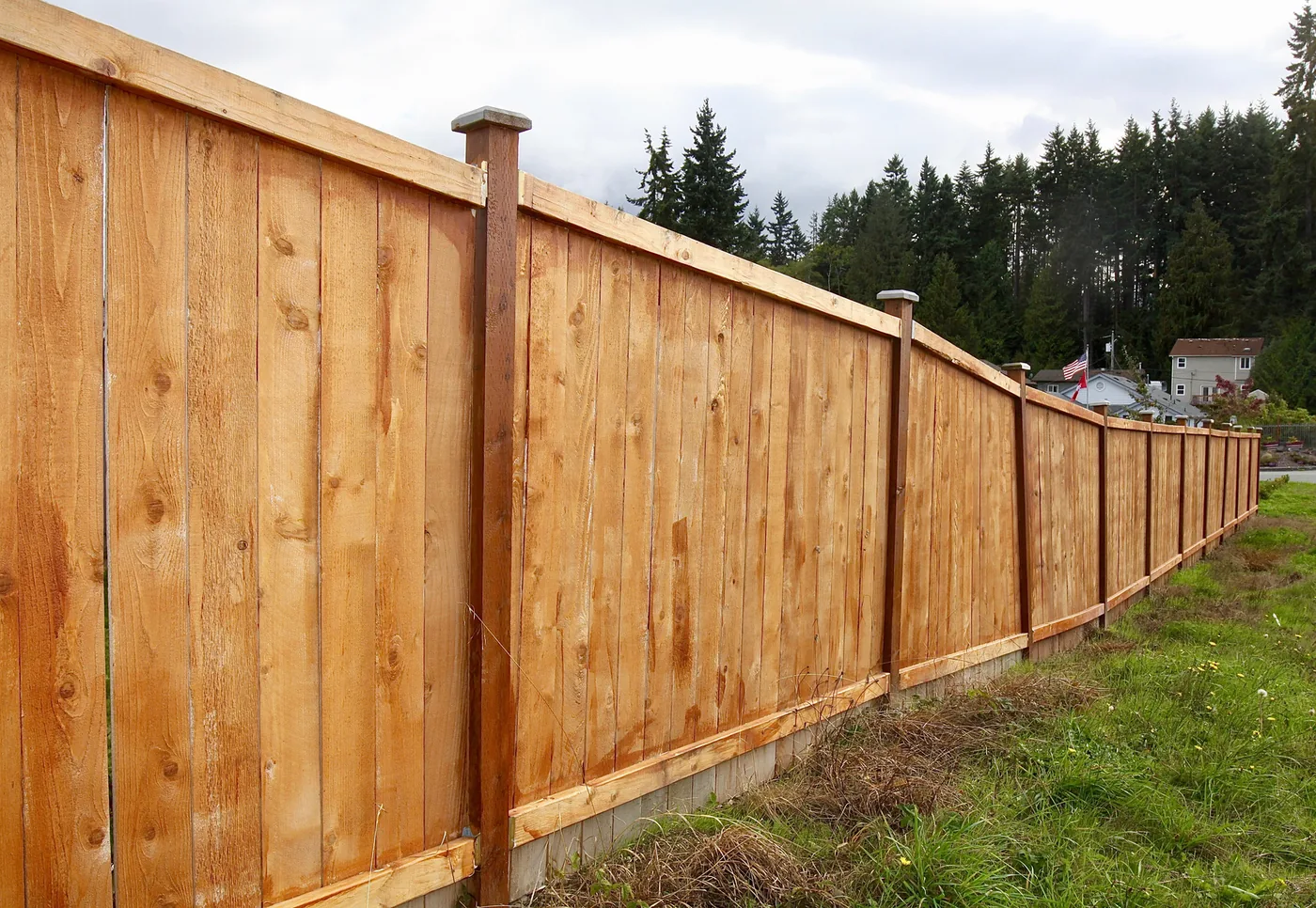 Cedar fence installed along a residential property