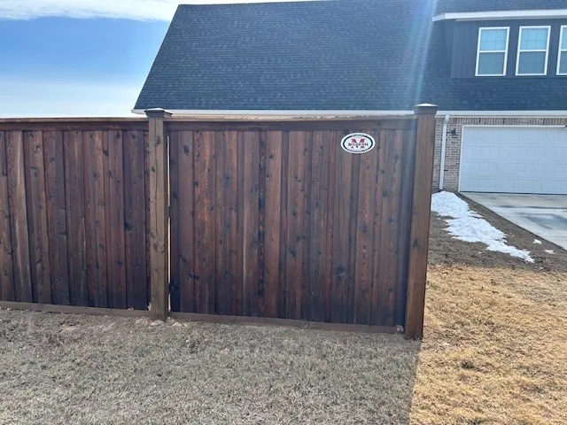 Wood fence and gate built on a galvanized steel frame