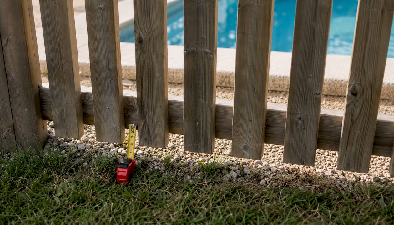 Pool fence picket spacing and bottom clearance detail