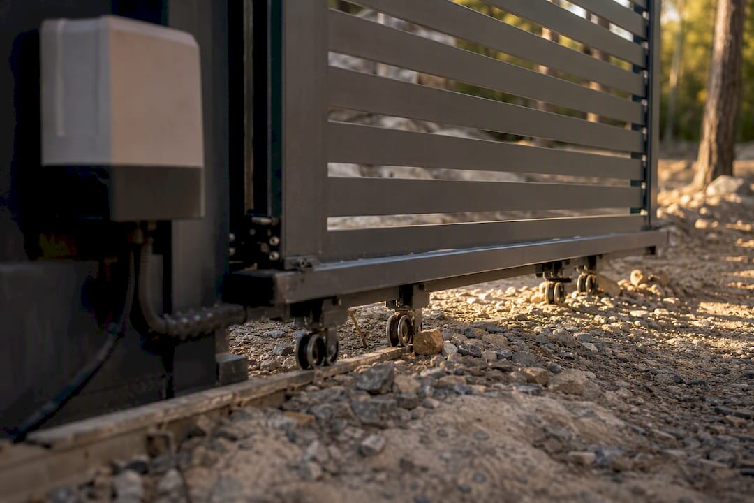 Cantilever sliding gate rollers on uneven driveway